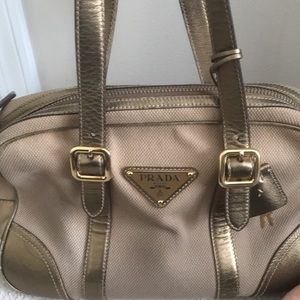 Prada bowing metal purse